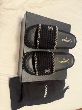 CHANEL Black Braided Slides with Gold Chain Accents
